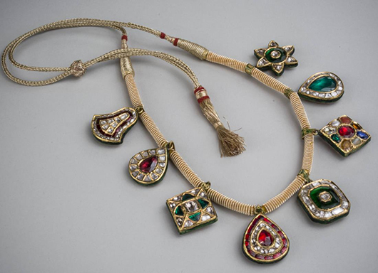 Mughal filigree pendant necklace composed of eight pendants set with flat cut diamonds, emeralds, tourmaline, sapphires and rubies. Sold for $6,000. Capo Auction image